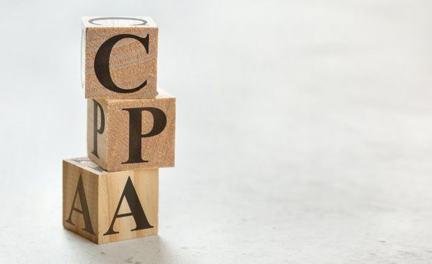 Stack of wooden cubes that read CPA. CPA offers many benefits beyond help with filing your taxes every year