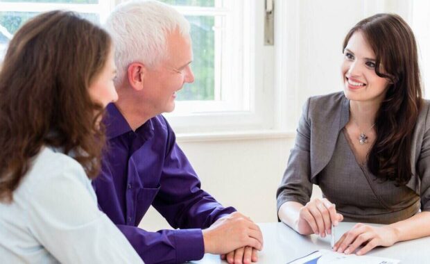 woman and man with business advisor on financial planning