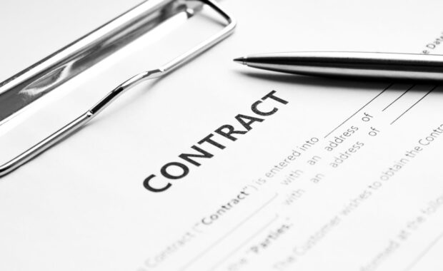 silver pen on docunent contract