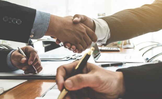 businessman and lawyers handshake after meeting