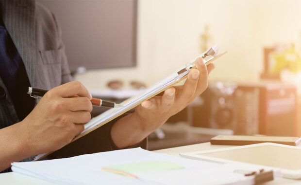 cpa looking through a sam renewal application