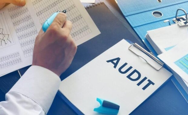 document with title audit on an office table