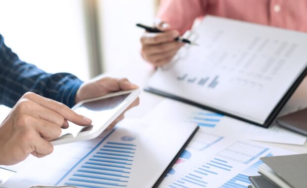 business team working with plan on office desk with new startup project