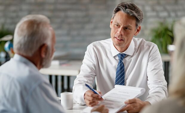 agent speaking with client about their contract