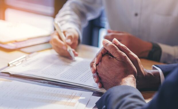 businessman reading documents at meeting