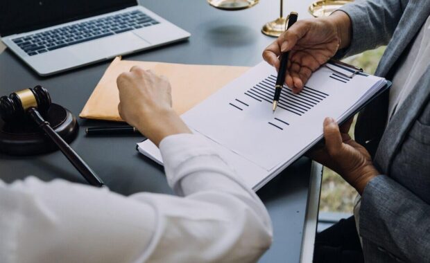 judge gavel with justice lawyers having team concepts of law and legal services