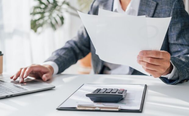 asia business man working on tax consultant law in a modern office