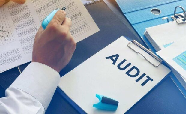 document with title audit on an office table