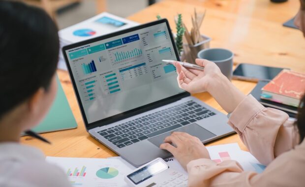 businesspeople or an accountant team are analyzing data charts, graphs