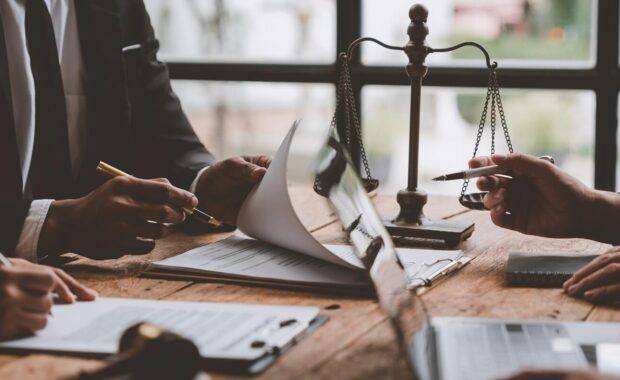 entrepreneur is reviewing a business contract or insurance contract for future benefits